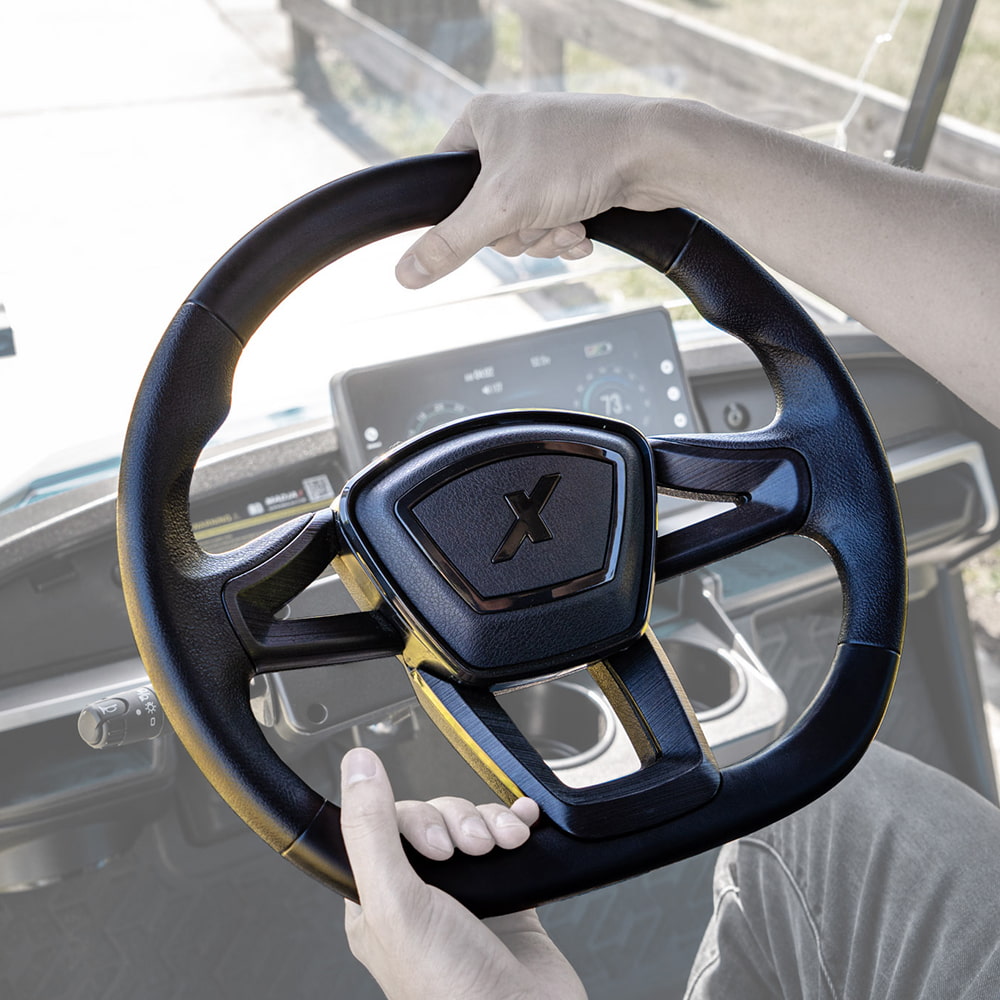 MadJax Cruise golf cart steering wheel installed and in use on an XSeries Storm golf cart.