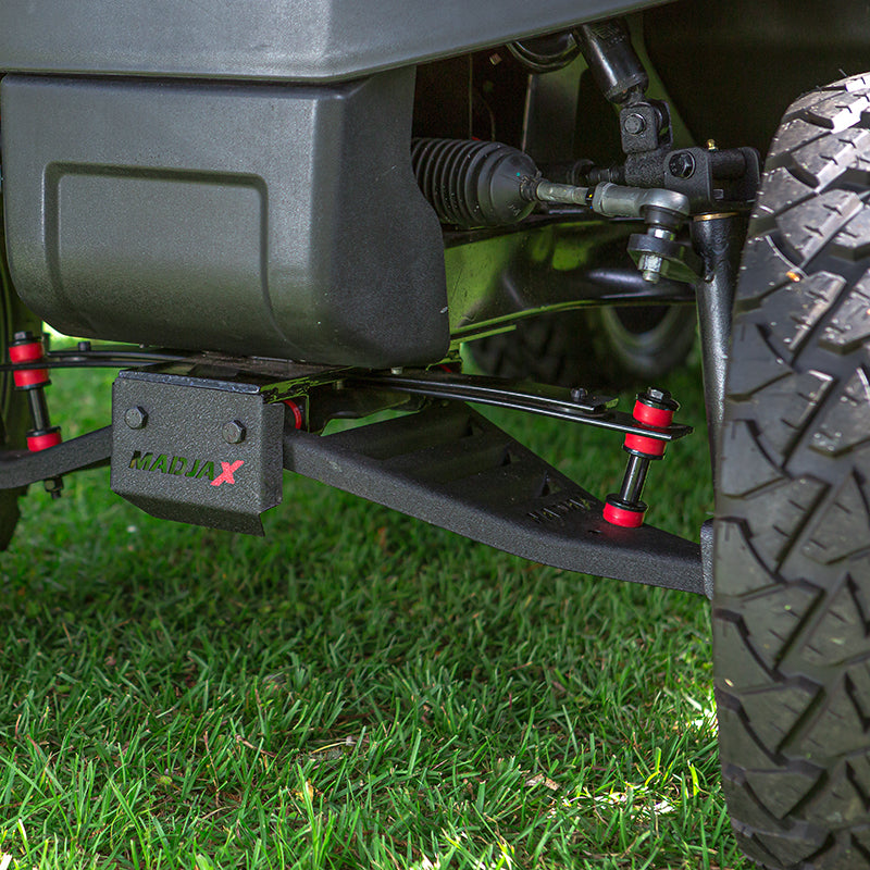 King XD Club Car lift kit installed on Tempo, parked in a yard, featuring urethane bushings, louvered and vented lower heavy duty control arms, and laser cut MadJax logo in the front plate.