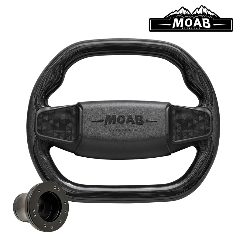 Custom golf cart MOAB steering wheel in gloss black finish, featuring MOAB embossed logo, simulated carbon fiber inlays, and sporty flat bottom design, while also including golf cart model adapter and free shipping, sold by Salt City Golf Cart in Hutchinson, Kansas, Item #WA0008.