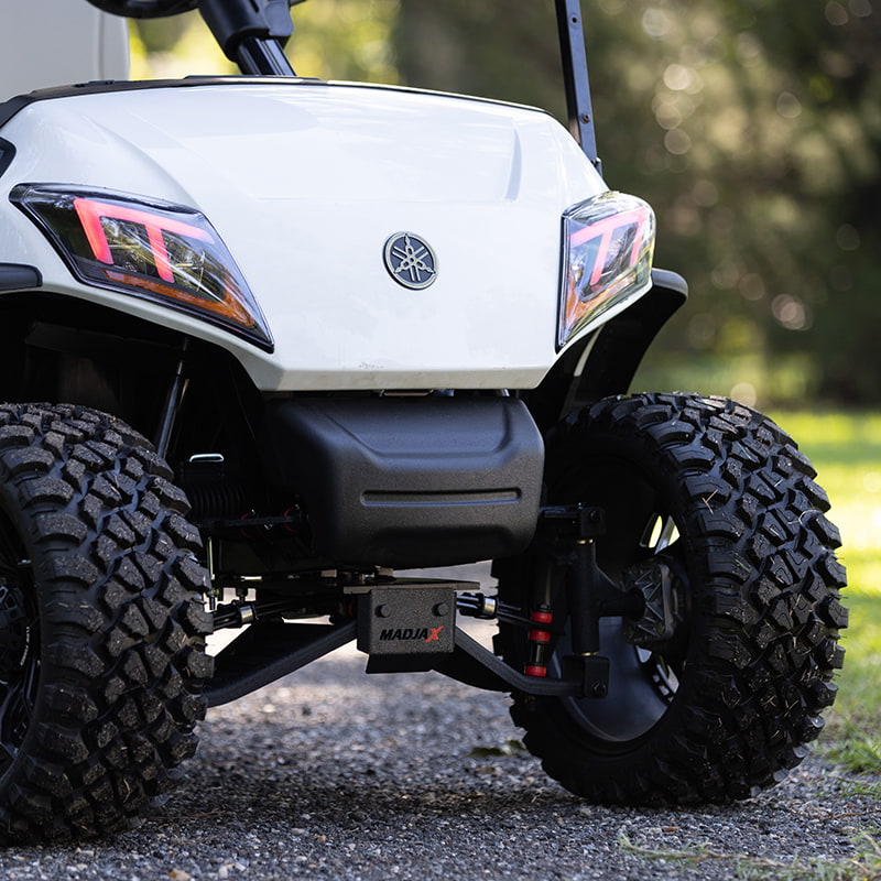 Close up view of the King XD 16-062 lift kit installed on a white Yamaha Drive2 golf cart with 22" tall tires, sold by Salt City Golf Cart in Hutchinson, Kansas.