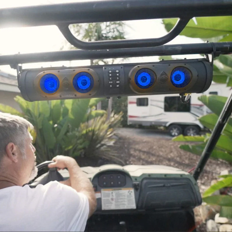 SE26 SoundExtreme soundbar mounted in a UTV being driven near an RV in a park.