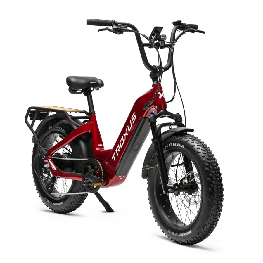 Angled front view of the red metallic 2024 model Troxus Lynx Plus Fat Tire E-Bike for sale near 67501 zip code.