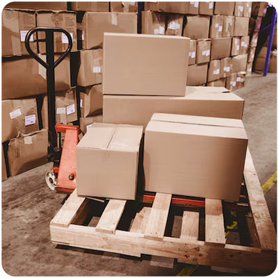 Boxes on a pallet in a warehouse showcasing bulk wholesale discounts available for golf cart builders on light kits, rear seats, and windshields for EZGO, Yamaha, and Club Car, from Salt City Golf Cart in Hutchinson, Kansas.